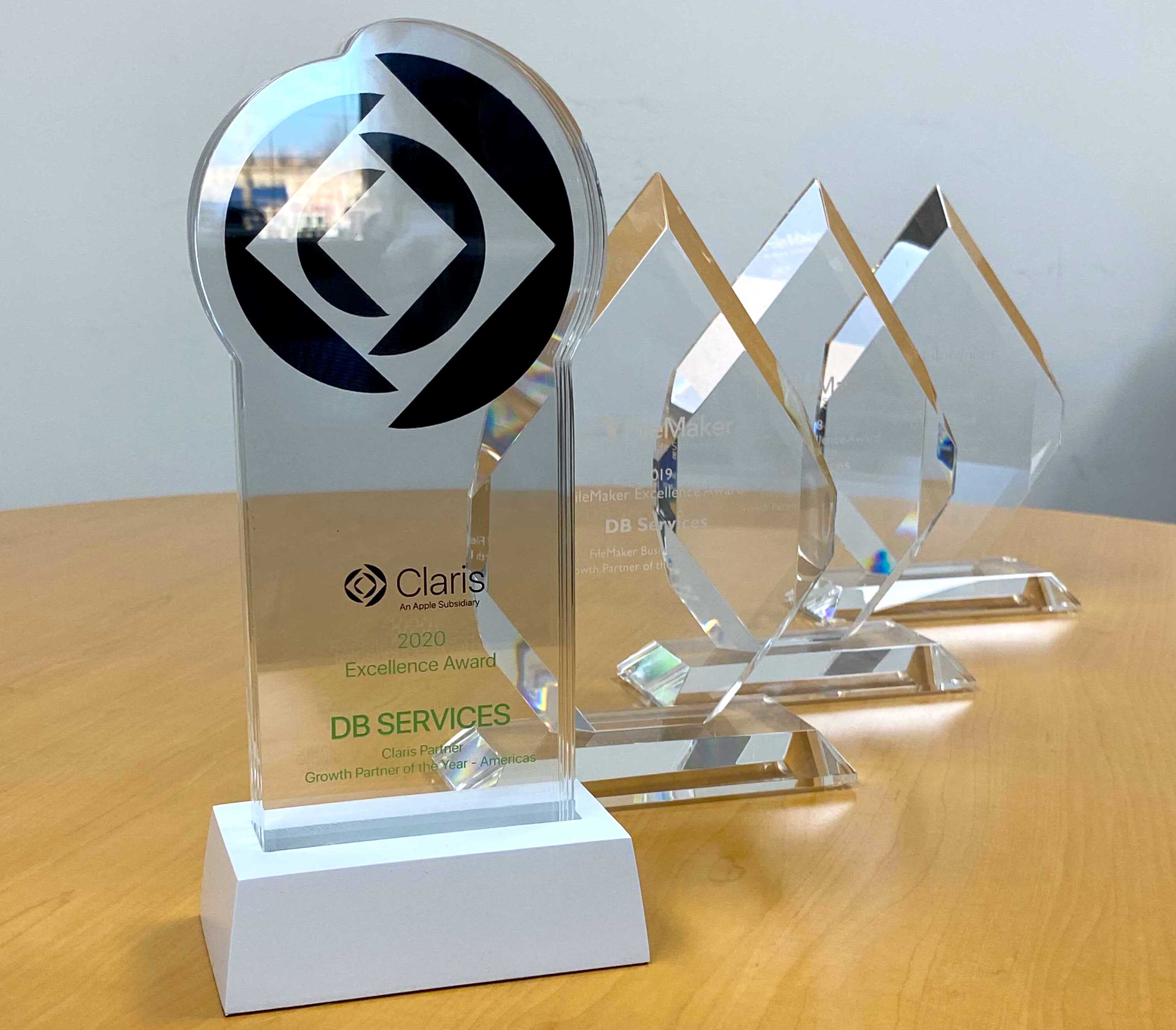 DB Services' collection of 4 Claris partner of the year awards